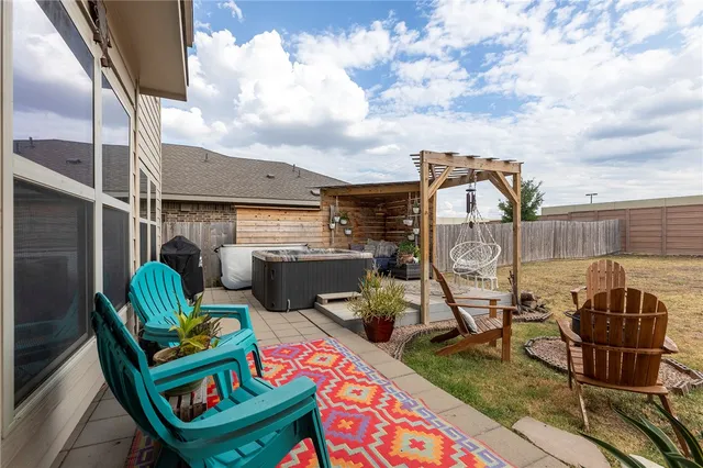 a backyard of a house with seating space