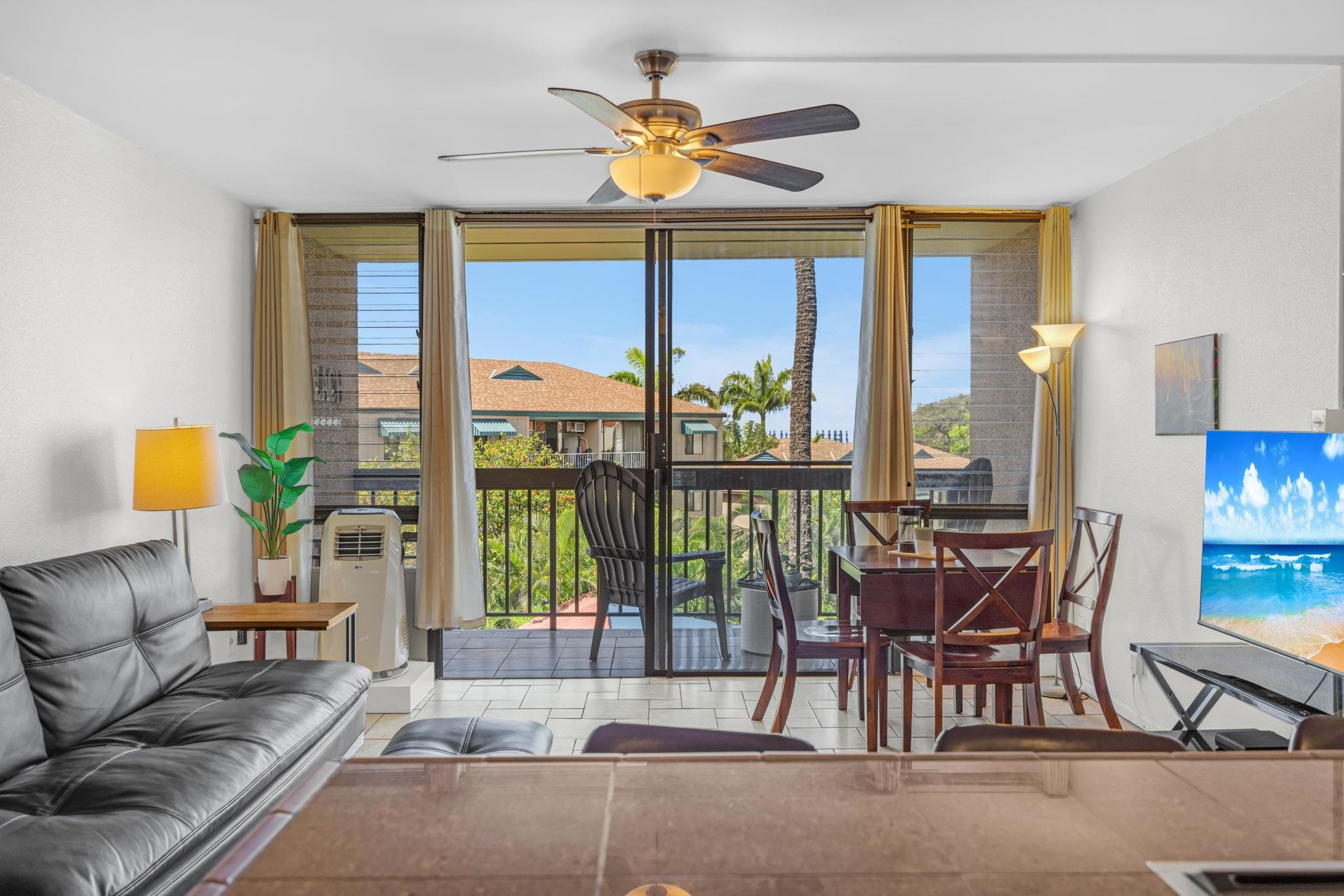 2191 South Kihei Road, Unit 2306 Kihei, HI 96753 - Photo 11 of 41 a living room with furniture and a large window