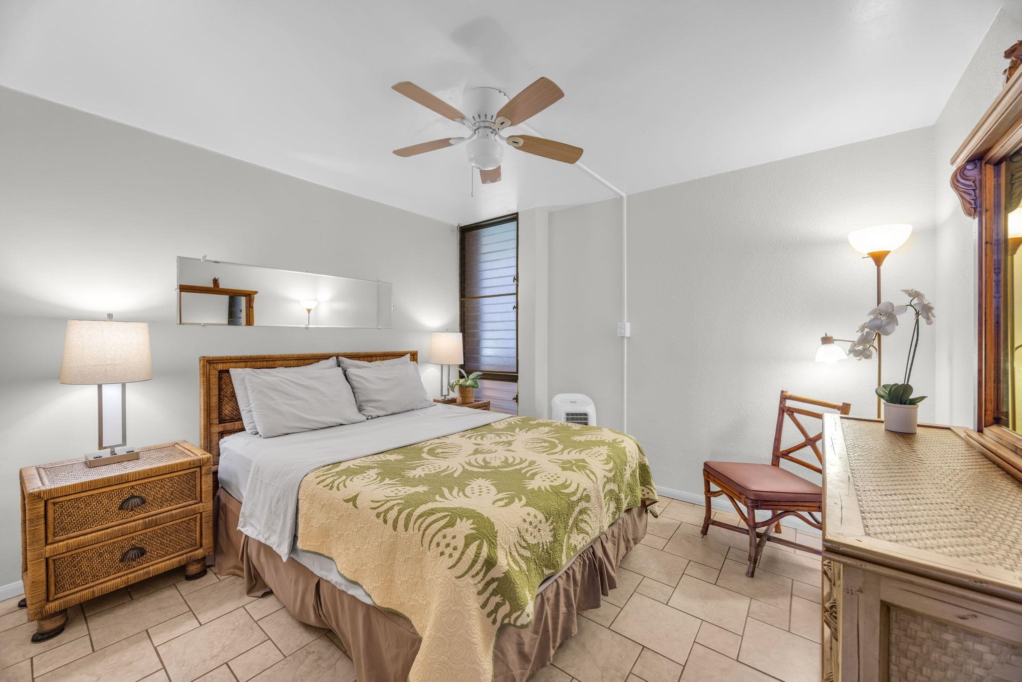 2191 South Kihei Road, Unit 2306 Kihei, HI 96753 - Photo 18 of 41 a bedroom with a bed and a chandelier