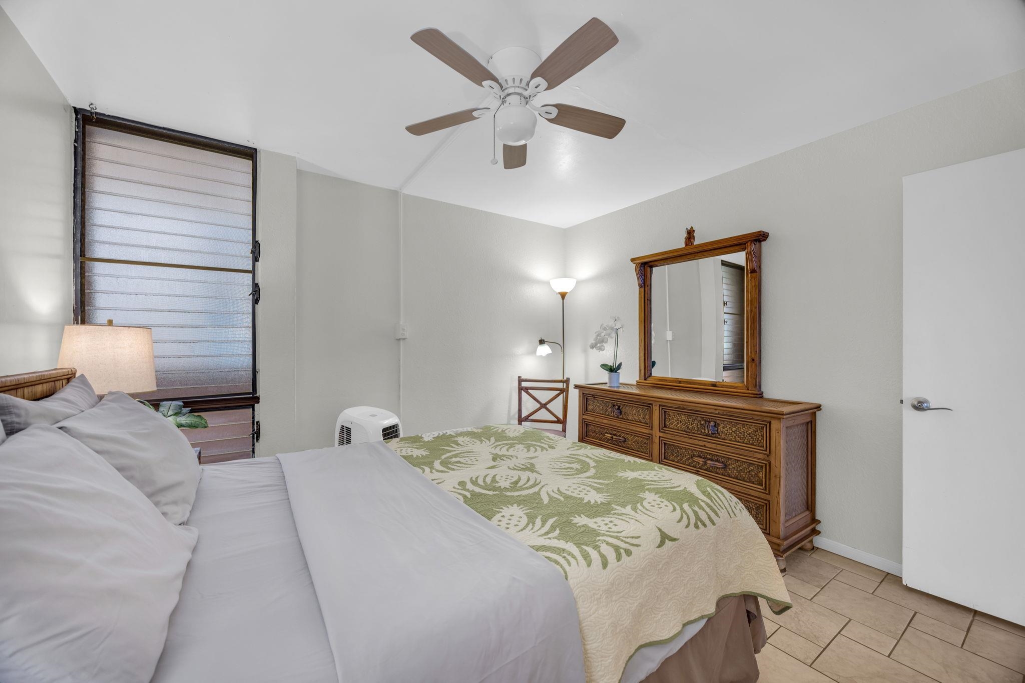 2191 South Kihei Road, Unit 2306 Kihei, HI 96753 - Photo 19 of 41 a bedroom with a bed and window