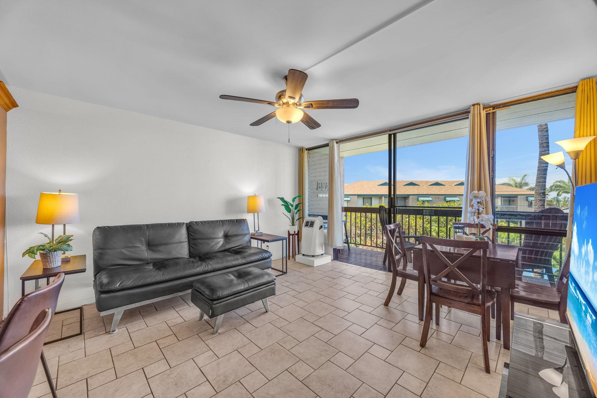 2191 South Kihei Road, Unit 2306 Kihei, HI 96753 - Photo 2 of 41 a living room with furniture tv and a large window