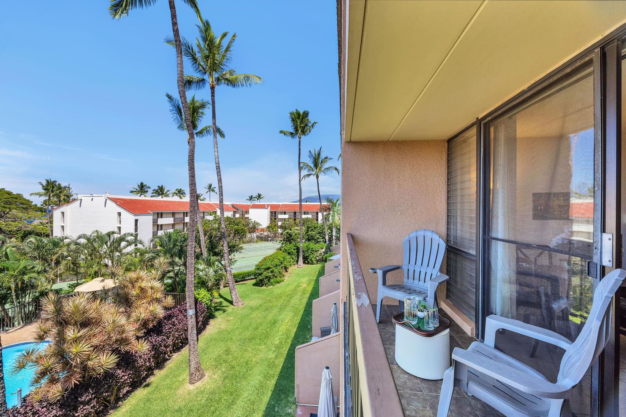 2191 South Kihei Road, Unit 2306 Kihei, HI 96753 - Photo 22 of 41 a view of a chair and table in the patio with potted plants
