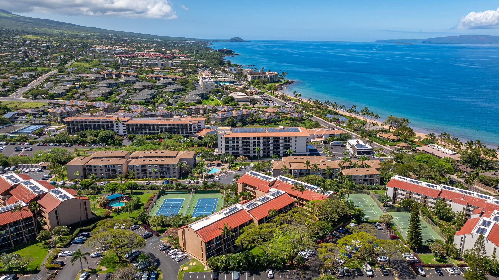 2191 South Kihei Road, Unit 2306 Kihei, HI 96753 - Photo 27 of 41 an aerial view of a city with lots of residential buildings ocean and mountain view in back