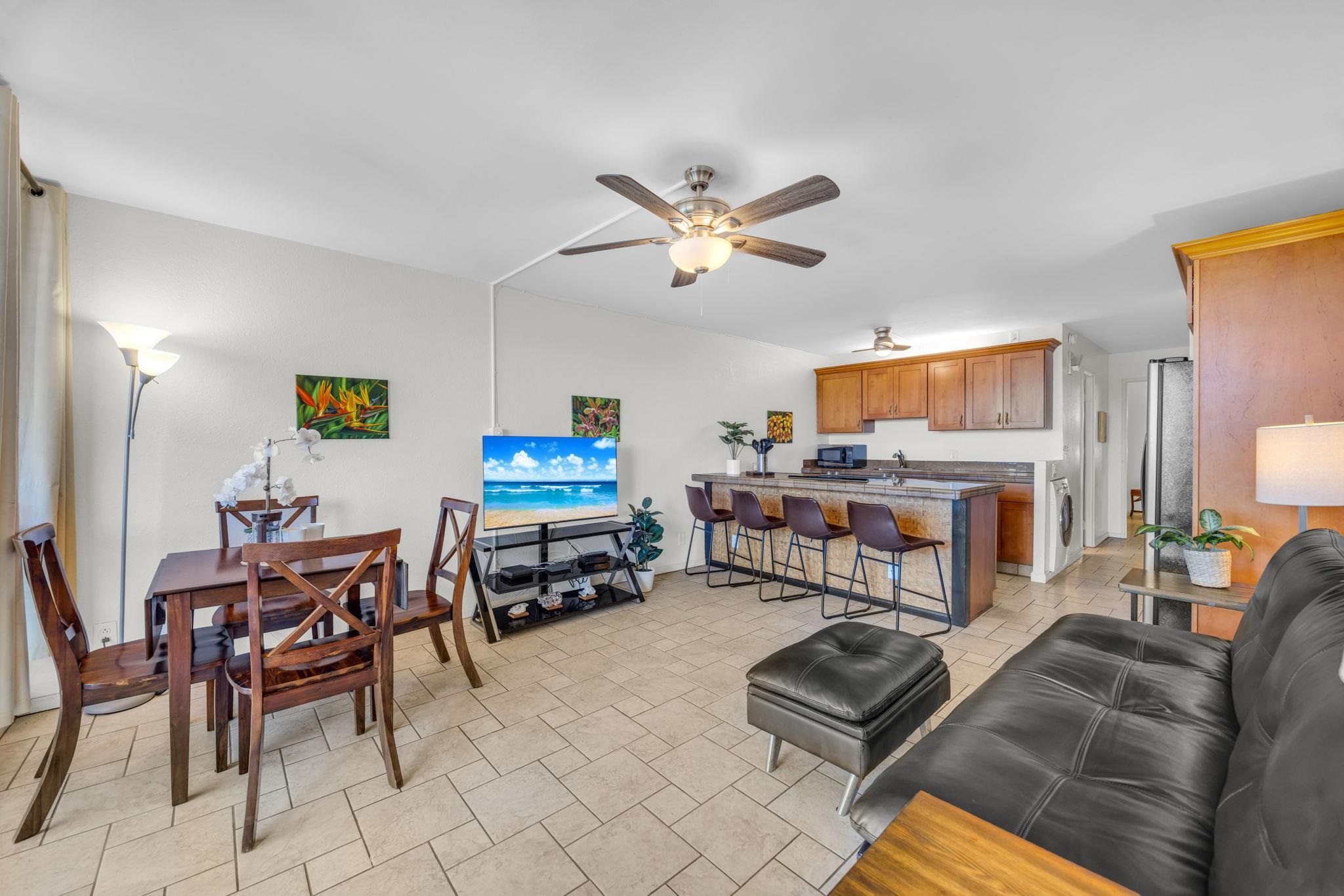 2191 South Kihei Road, Unit 2306 Kihei, HI 96753 - Photo 3 of 41 a living room with furniture and a flat screen tv