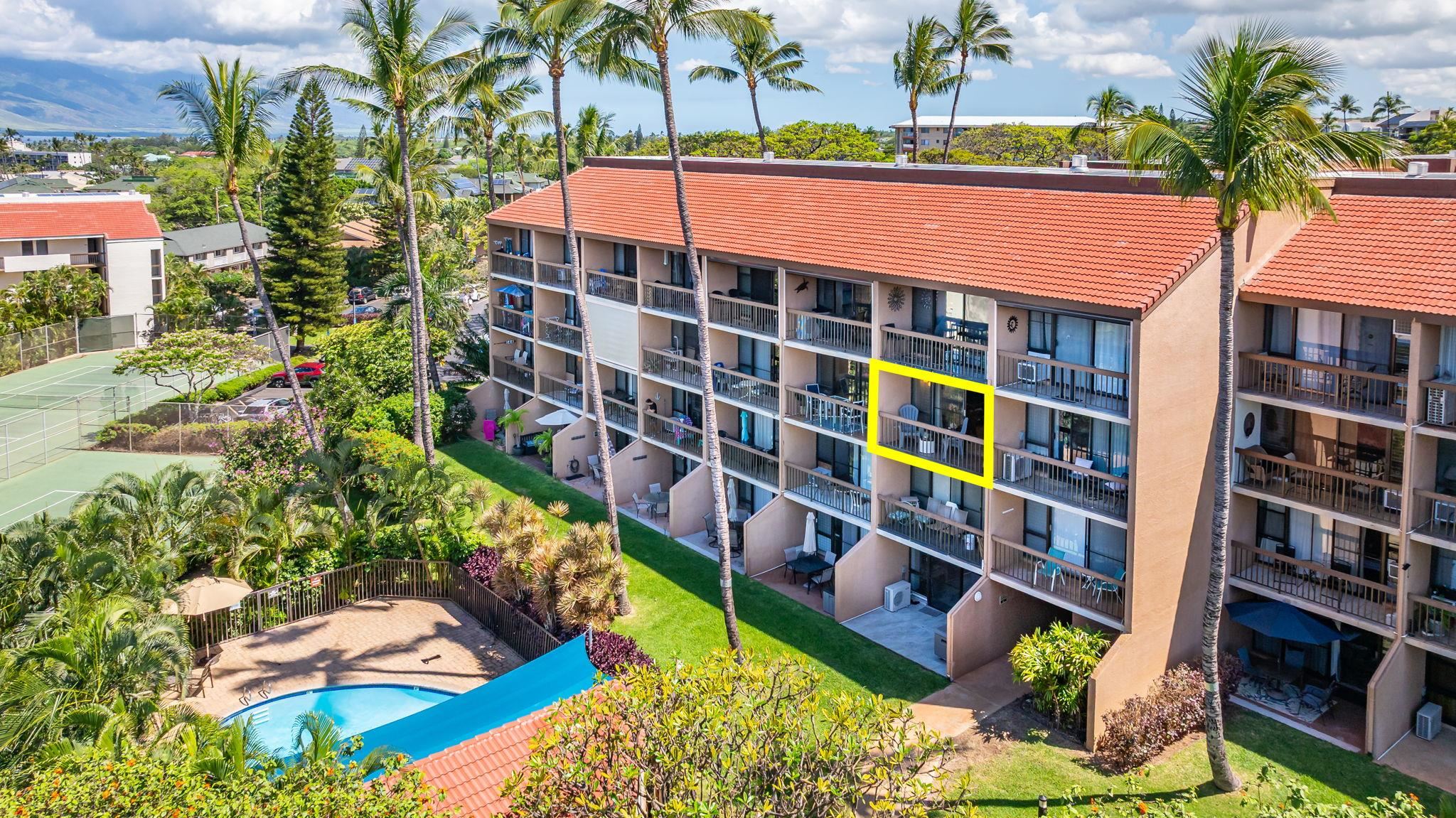 2191 South Kihei Road, Unit 2306 Kihei, HI 96753 - Photo 34 of 41 a front view of a multi story building with yard