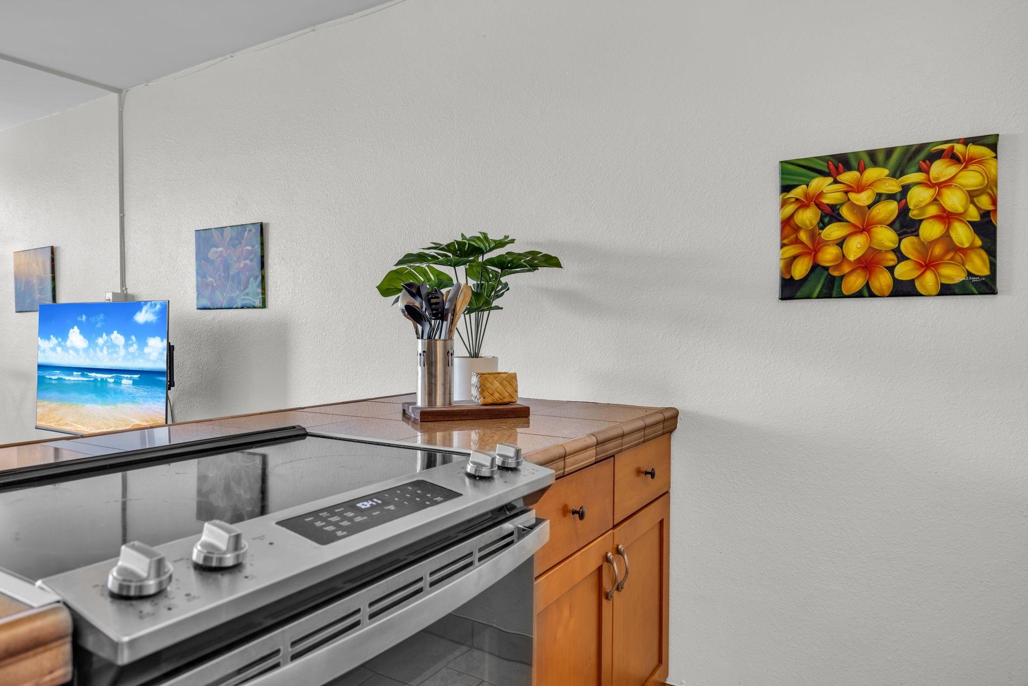 2191 South Kihei Road, Unit 2306 Kihei, HI 96753 - Photo 10 of 41 a kitchen with a stove and a sink