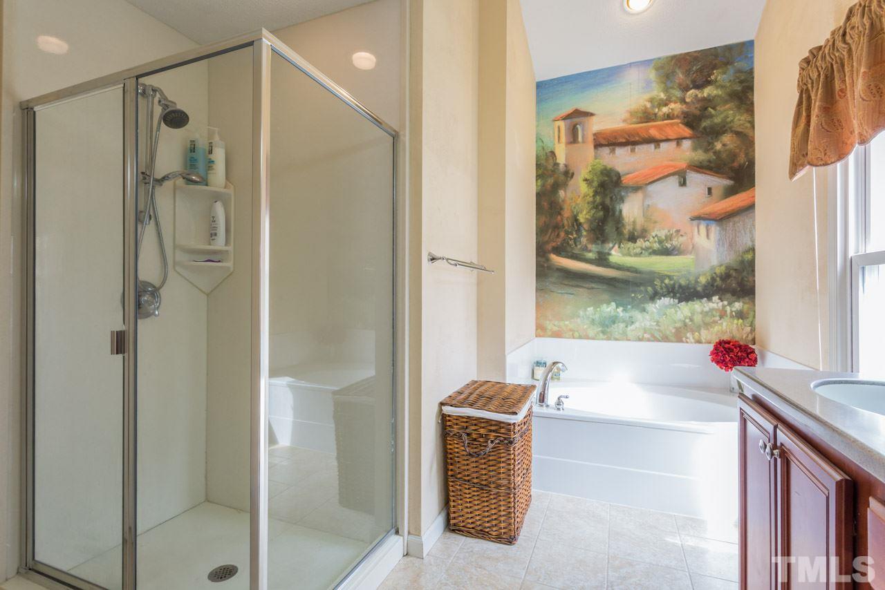 4305 Birmingham Way Raleigh, NC 27604 - Photo 17 of 23 a bath room with a tub and shower