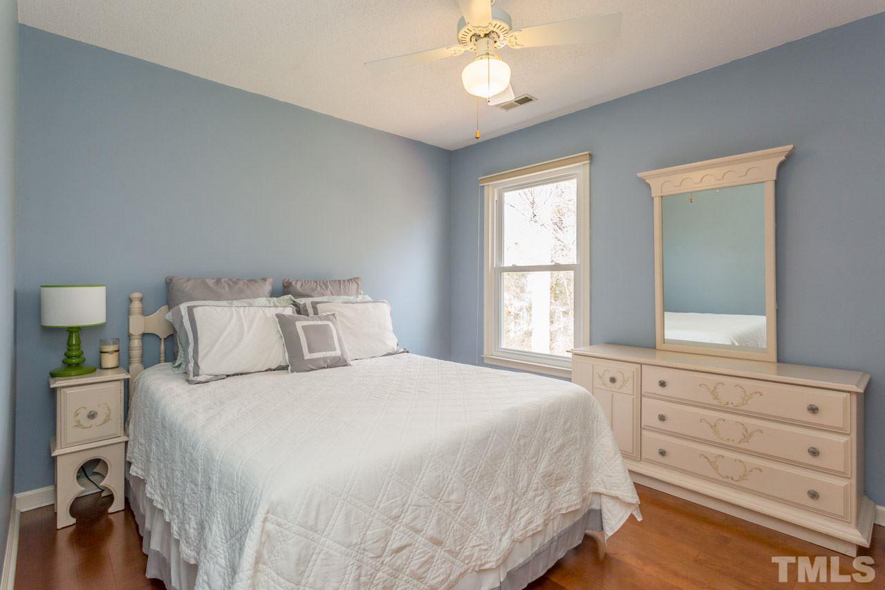 4305 Birmingham Way Raleigh, NC 27604 - Photo 18 of 23 a bedroom with a bed and a window