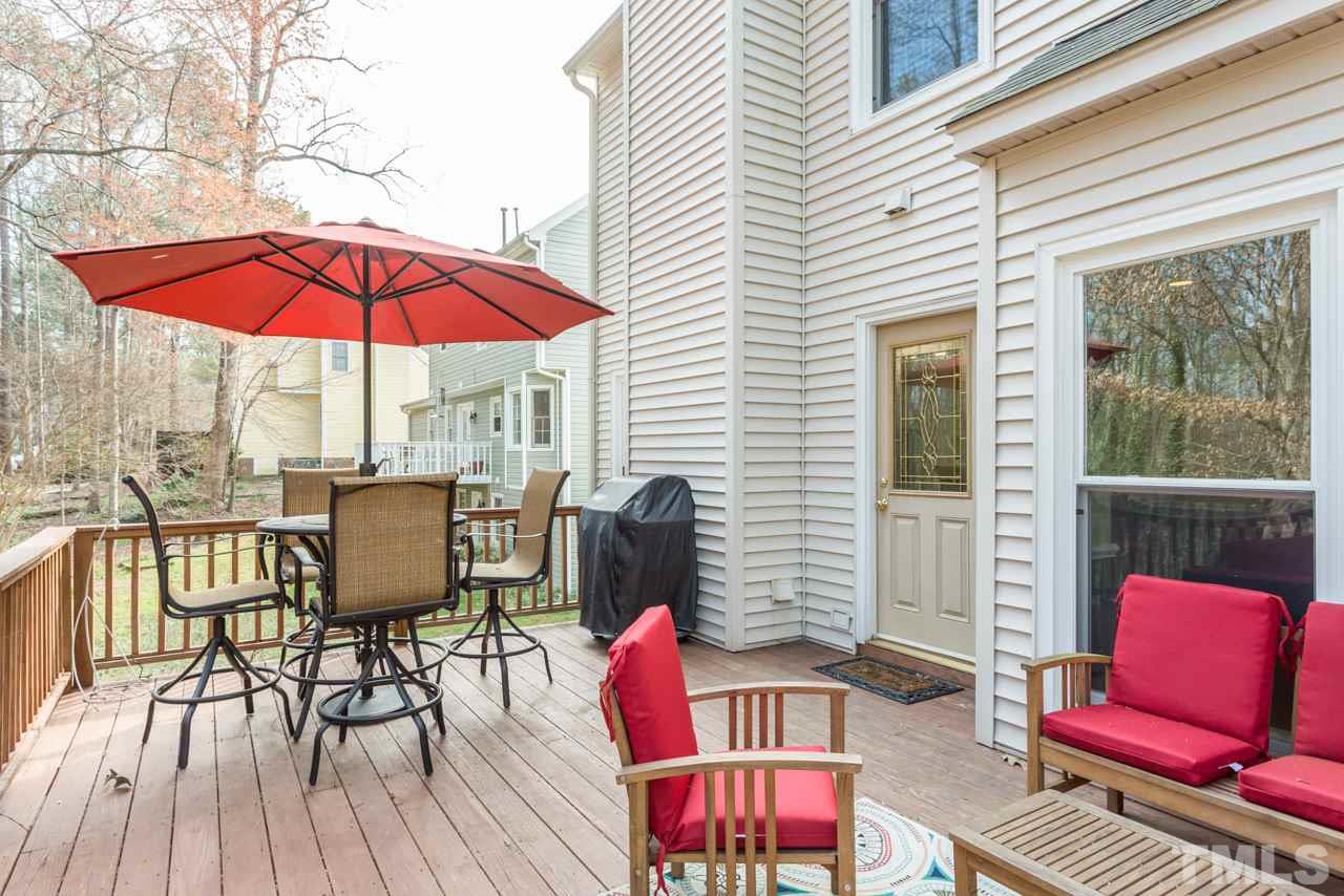 4305 Birmingham Way Raleigh, NC 27604 - Photo 21 of 23 a view of balcony with outdoor seating and wooden floor