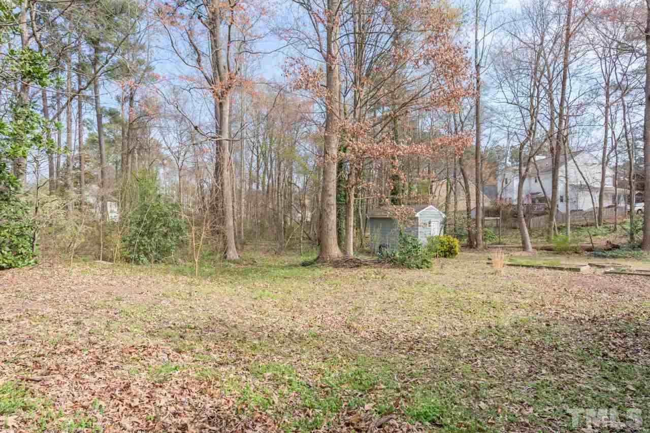 4305 Birmingham Way Raleigh, NC 27604 - Photo 22 of 23 a backyard of a house with lots of green space