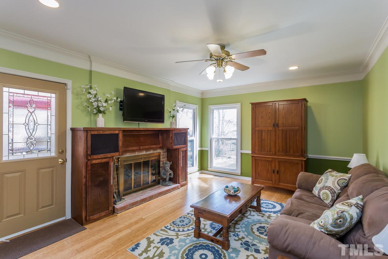 4305 Birmingham Way Raleigh, NC 27604 - Photo 6 of 23 a living room with furniture and a flat screen tv