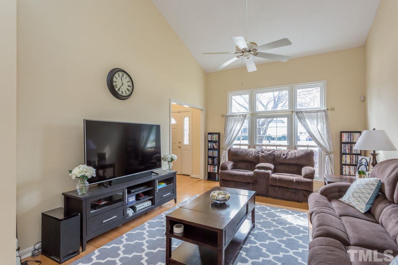 4305 Birmingham Way Raleigh, NC 27604 - Photo 9 of 23 a living room with furniture and a flat screen tv