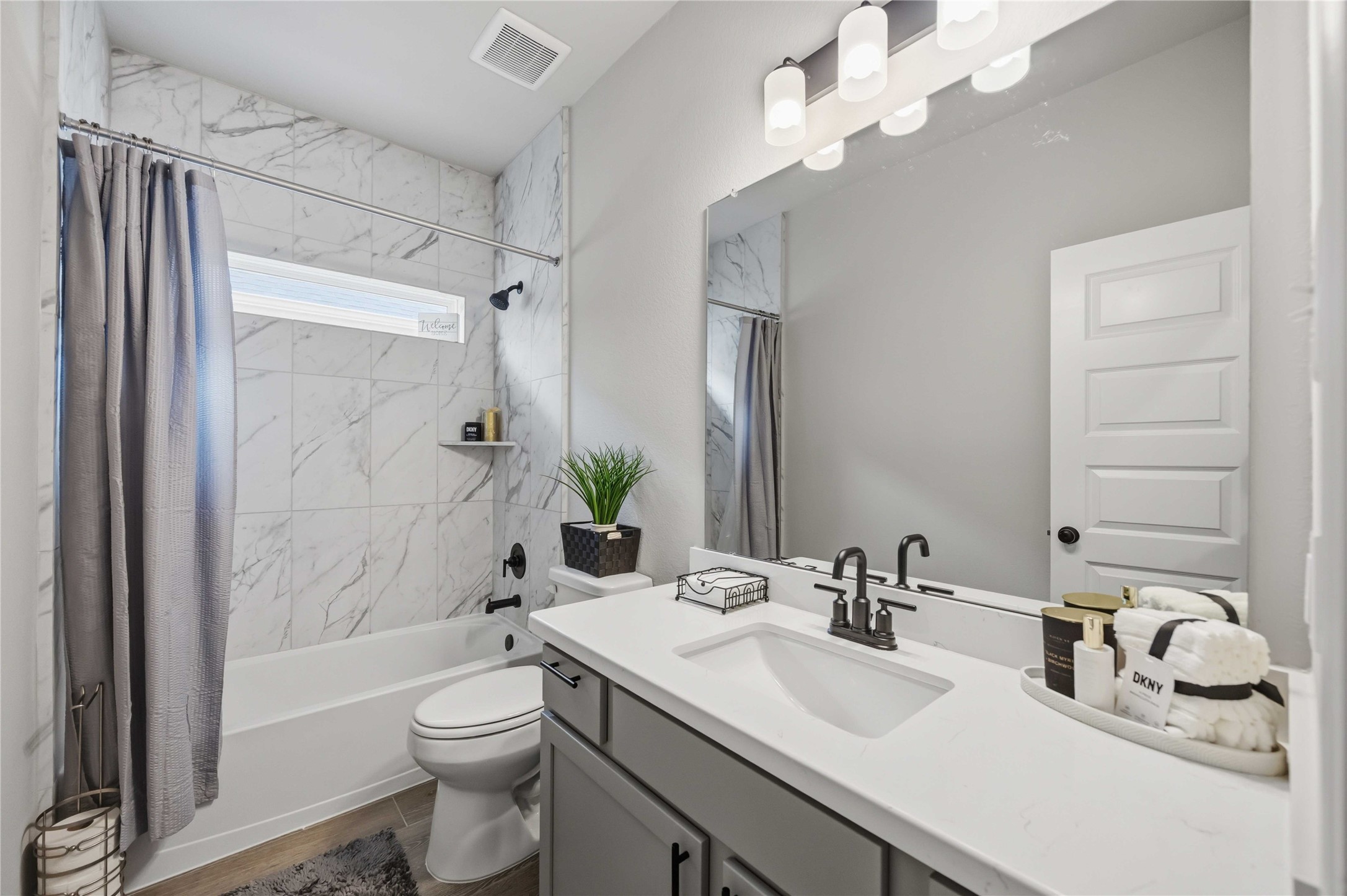 2808 Bisbee Road League City, TX 77573 - Photo 6 of 42 Bathroom 2- Quartz Counters, Black Finishes, & Marble-Inspired Tile