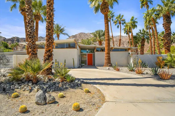 a view of a backyard of the house