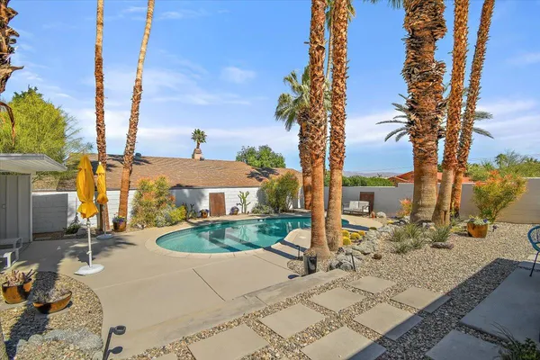 a view of a backyard with a patio