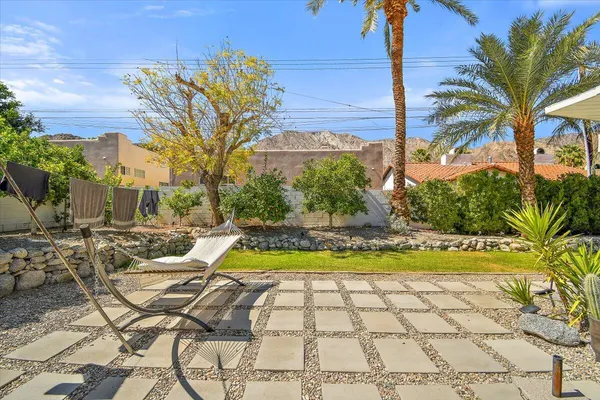 a view of a swimming pool with a lounge chairs
