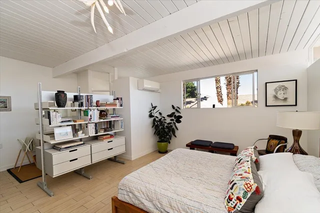 a bedroom with furniture and a bed