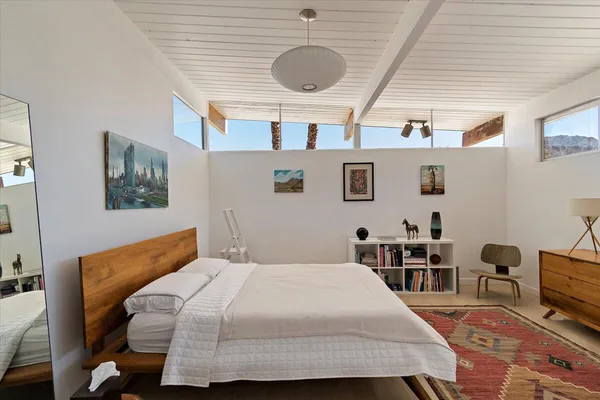 a bathroom with a shower sink and mirror