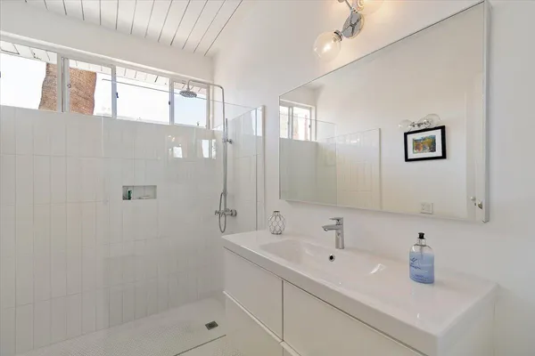 a view of a backyard with wooden fence