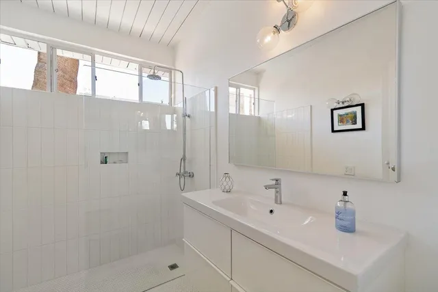 a view of a backyard with wooden fence