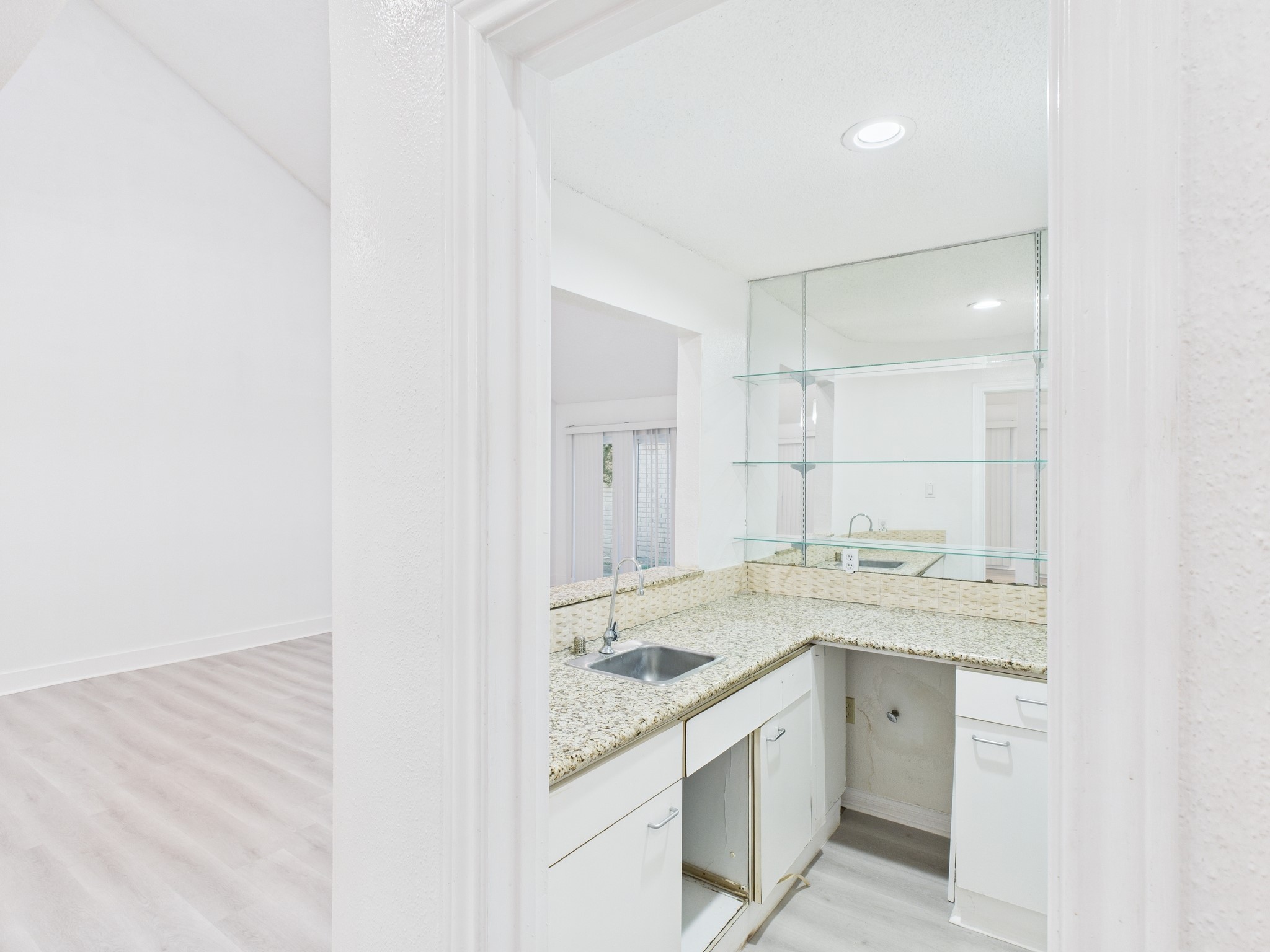 7610 Hopewell Lane Houston, TX 77071 - Photo 11 of 31 a view of a kitchen with a sink and cabinets