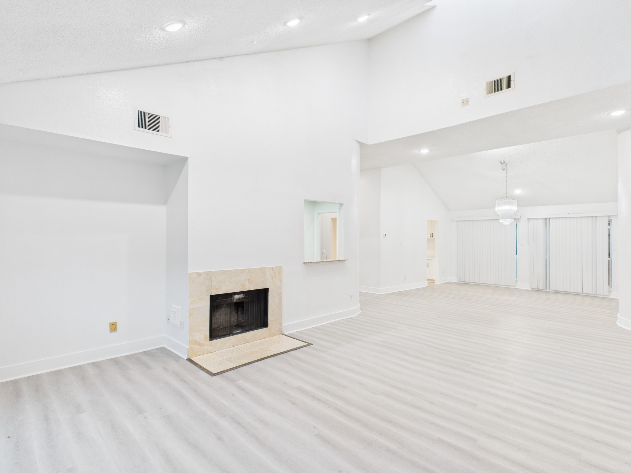 7610 Hopewell Lane Houston, TX 77071 - Photo 14 of 31 an empty room with wooden floor and fireplace
