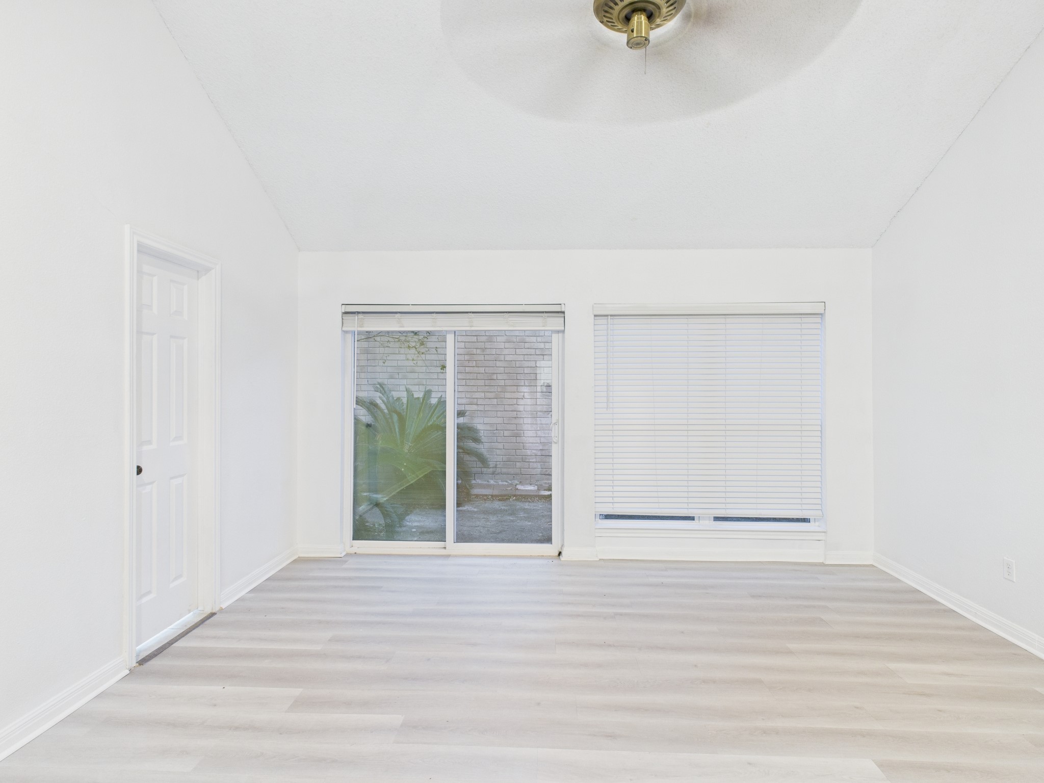 7610 Hopewell Lane Houston, TX 77071 - Photo 24 of 31 a view of an empty room with wooden floor and a window