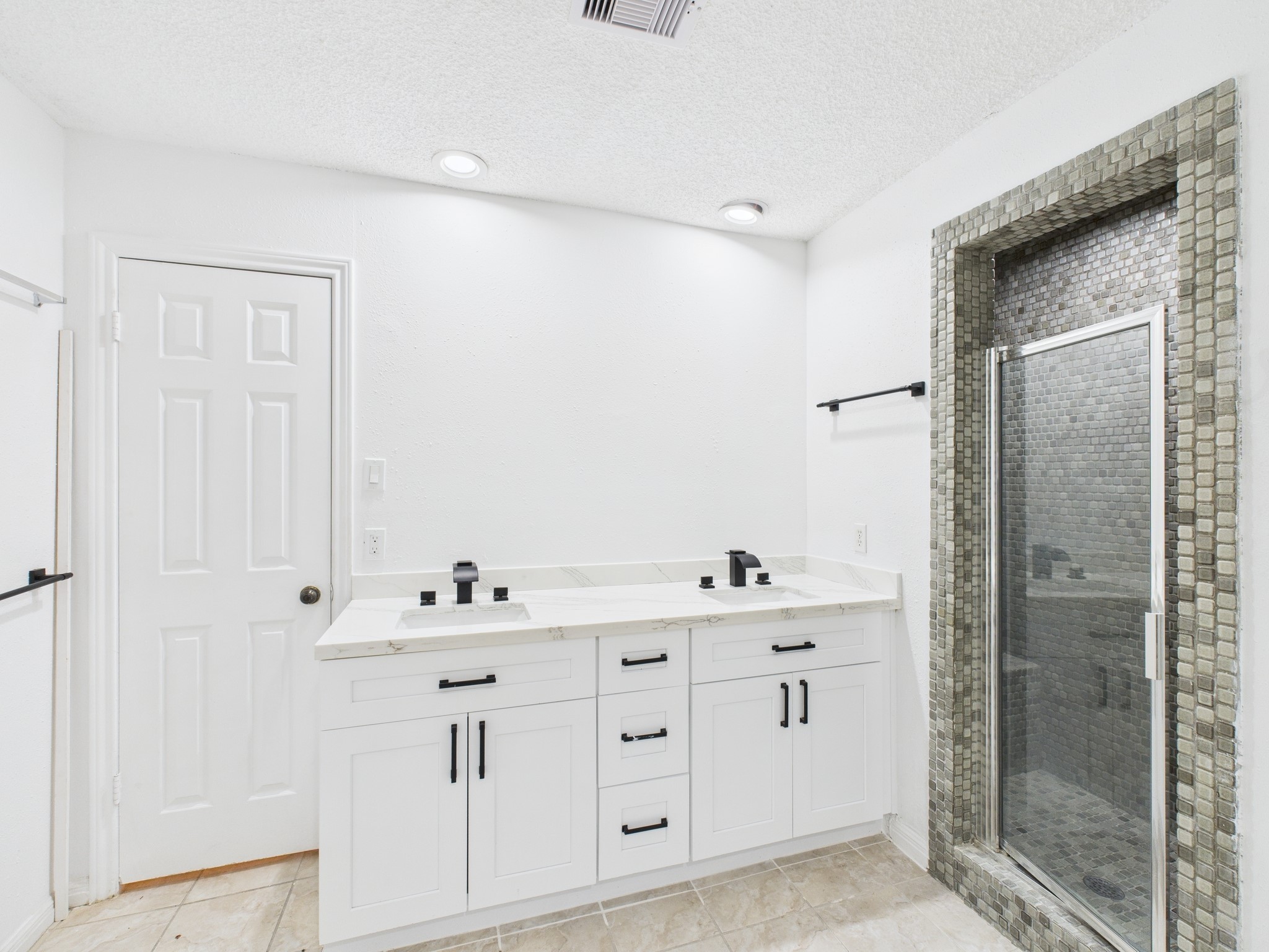 7610 Hopewell Lane Houston, TX 77071 - Photo 26 of 31 a spacious bathroom with a double vanity sink a mirror and shower