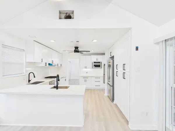 a view of a kitchen with a sink