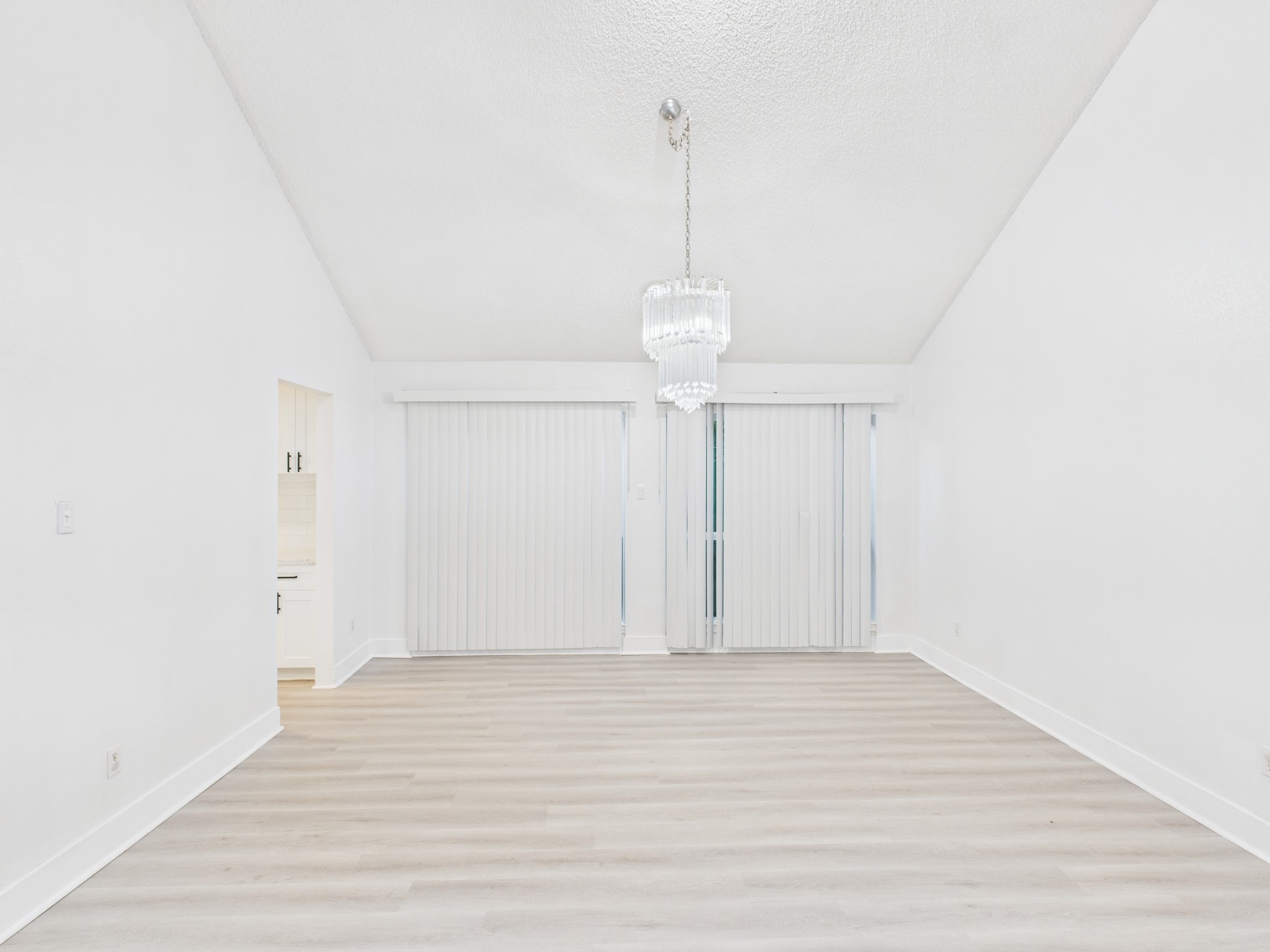 7610 Hopewell Lane Houston, TX 77071 - Photo 10 of 31 a view of an empty room with wooden floor