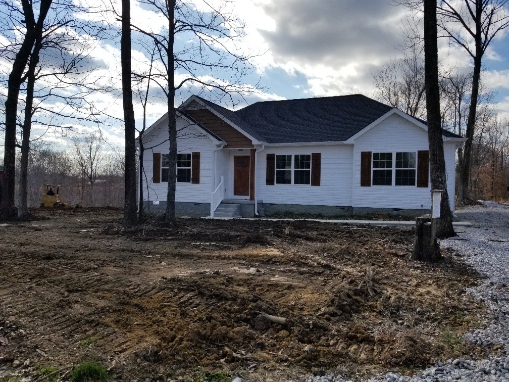 210 Hog Back Ridge Road Bethpage, TN 37022 - Photo 1 of 13 a house is sitting in middle of forest