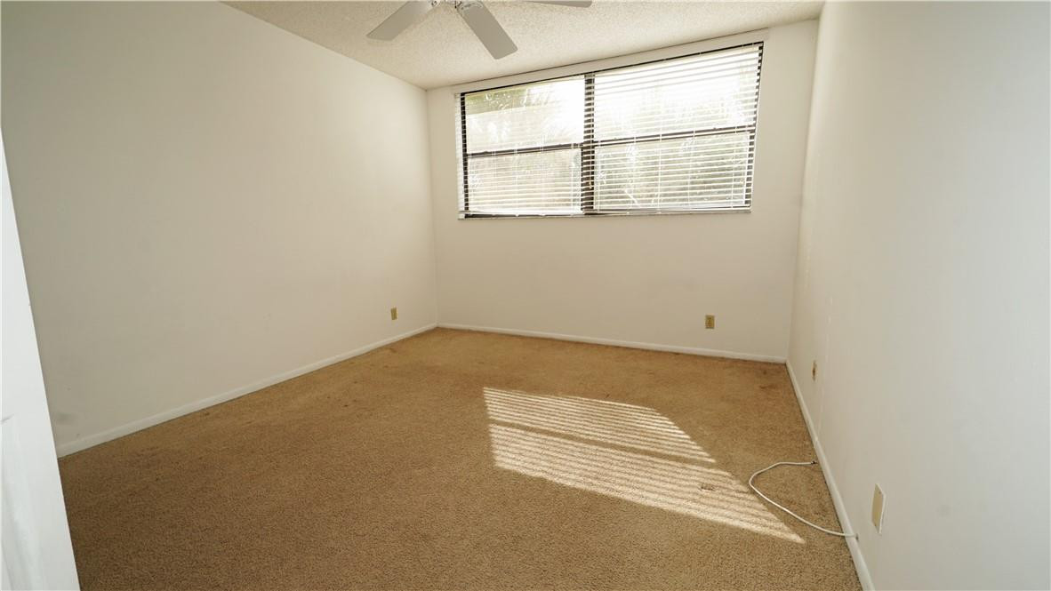 16400 Golf Club Road, Unit 305 Weston, FL 33326 - Photo 12 of 24 an empty room with a window