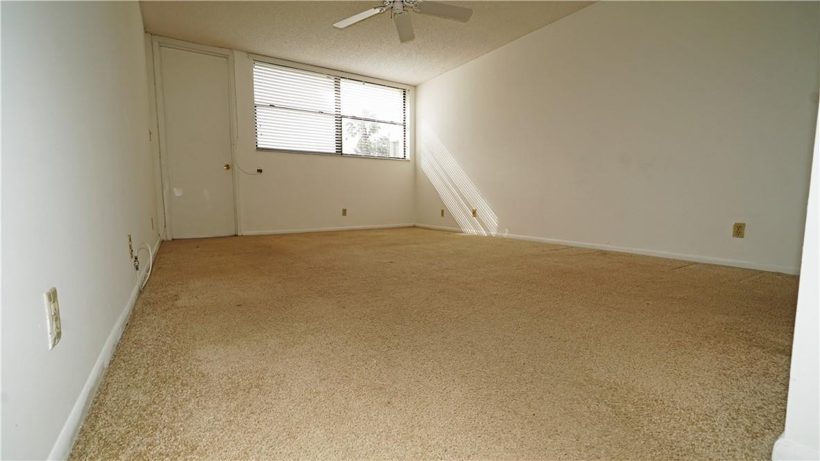 16400 Golf Club Road, Unit 305 Weston, FL 33326 - Photo 18 of 24 an empty room with a window