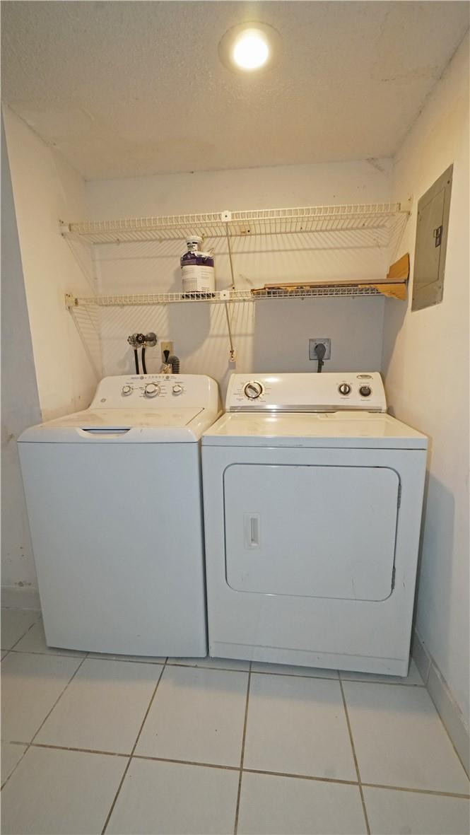 16400 Golf Club Road, Unit 305 Weston, FL 33326 - Photo 23 of 24 a utility room with dryer and washer