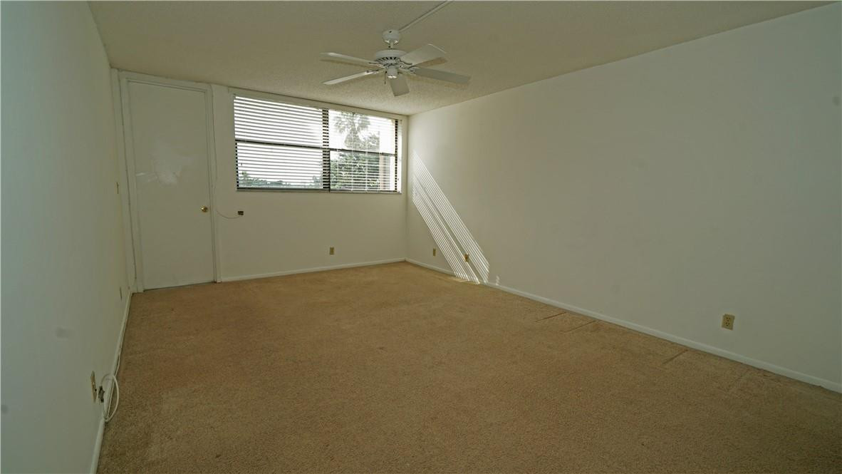 16400 Golf Club Road, Unit 305 Weston, FL 33326 - Photo 8 of 24 an empty room with a window