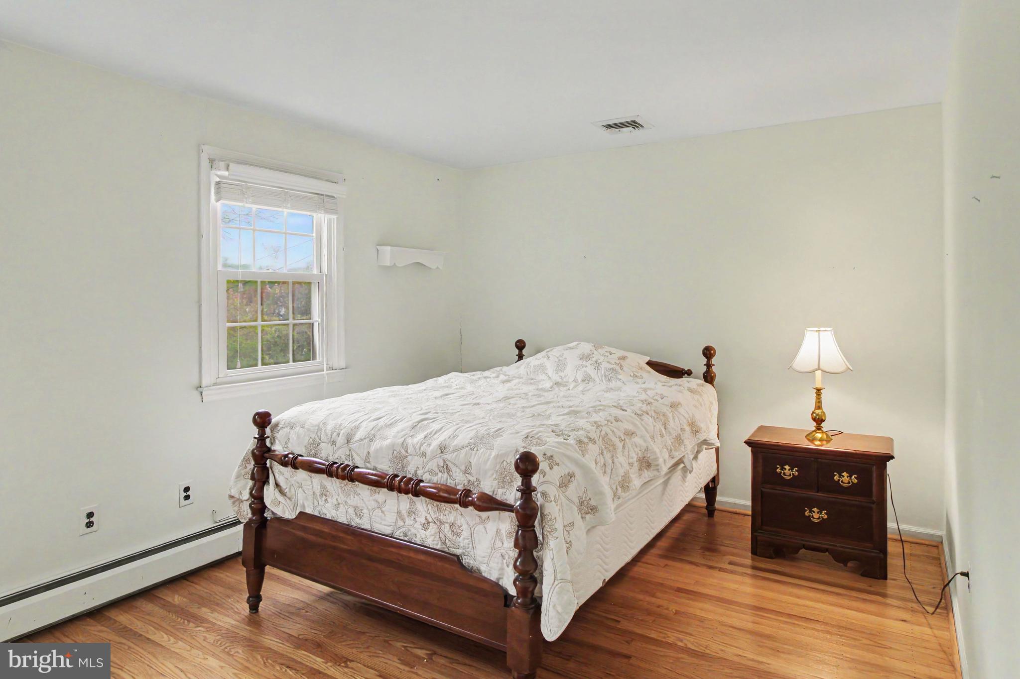 917 Cedar Grove Road Broomall, PA 19008 - Photo 20 of 33 a large bed sitting in a bedroom next to a window