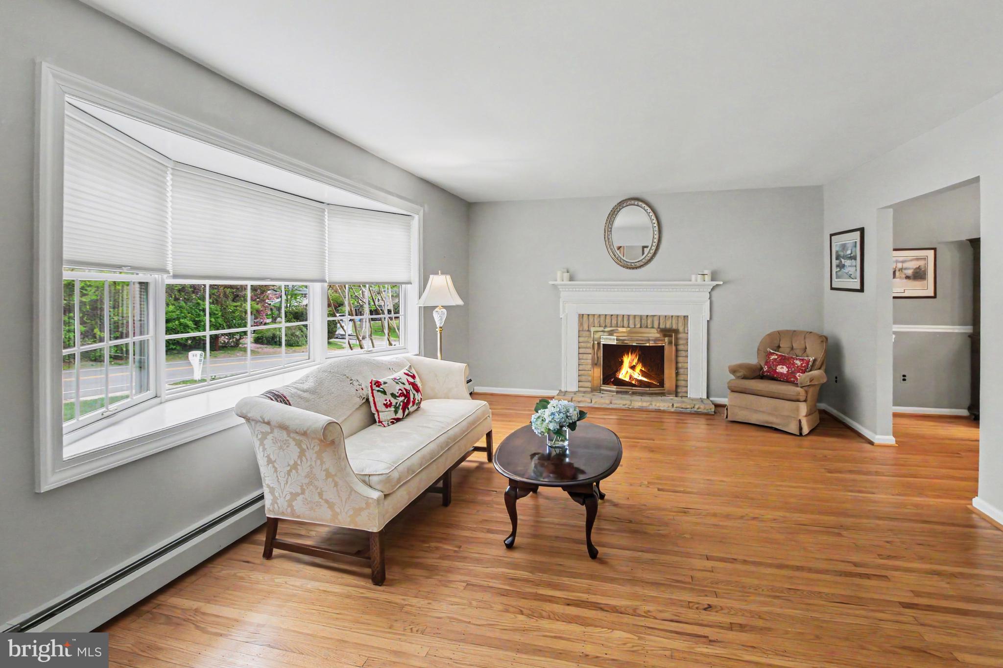 917 Cedar Grove Road Broomall, PA 19008 - Photo 5 of 33 a living room with furniture fireplace and window