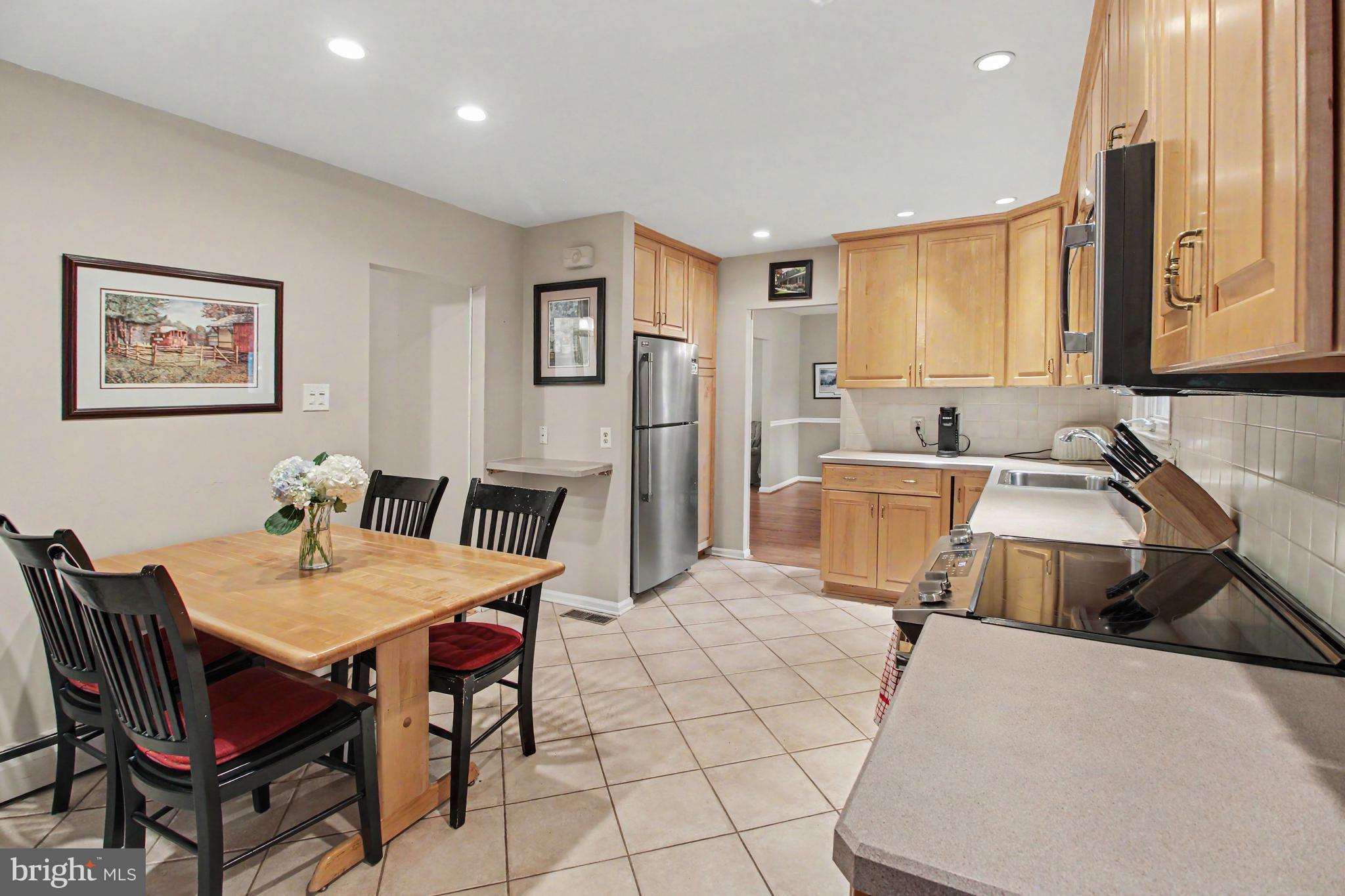 917 Cedar Grove Road Broomall, PA 19008 - Photo 9 of 33 a living room with a couch and a table