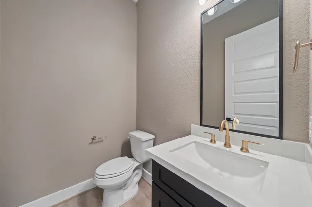 a spacious bathroom with a double vanity sink mirror and bathtub