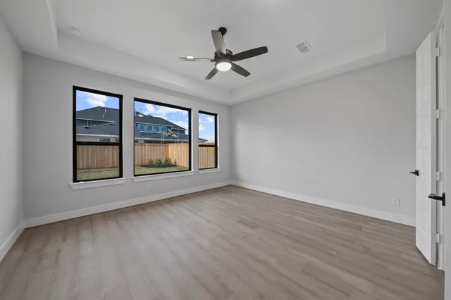 a spacious bathroom with a sink a mirror and a bathtub