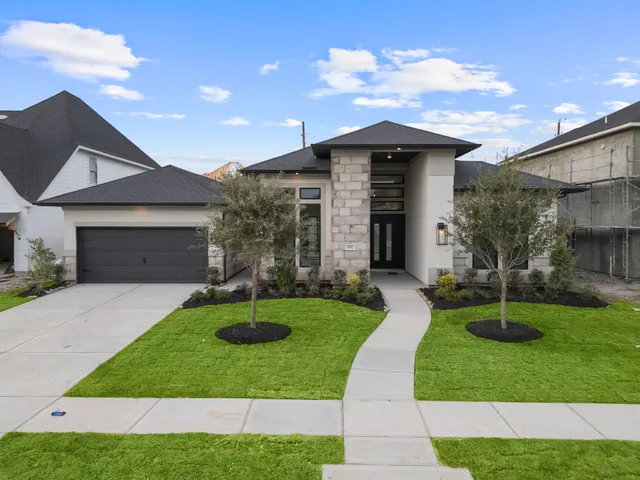 a view of a street with a house in the background