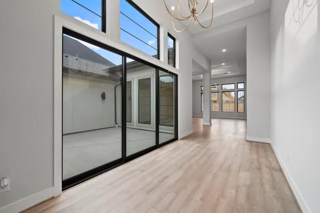 a kitchen with a sink a microwave and cabinets