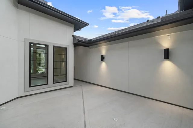 a kitchen with a sink a counter top space cabinets and a wooden floor