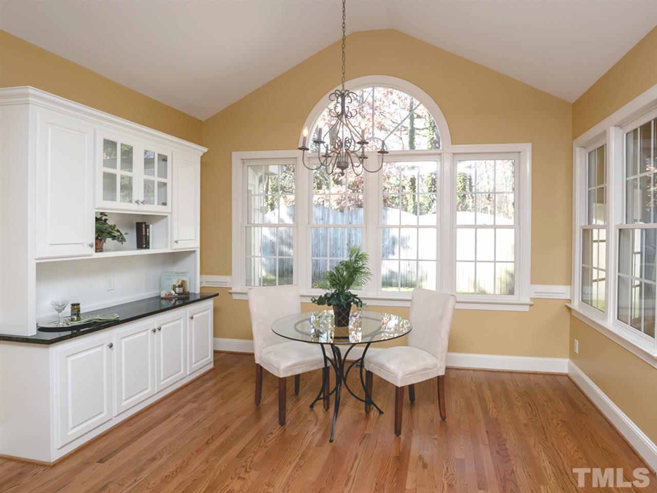 7909 Ridge Pointe Lane Raleigh, NC 27615 - Photo 12 of 25 Nook with built in buffet; cathedral ceiling with beautiful window