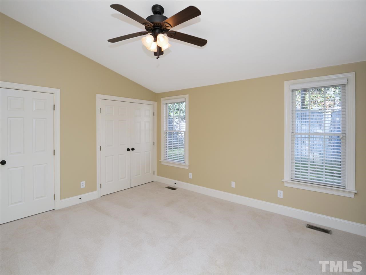 7909 Ridge Pointe Lane Raleigh, NC 27615 - Photo 13 of 25 In law suite bedroom with double closets; full bathroom; and exterior door