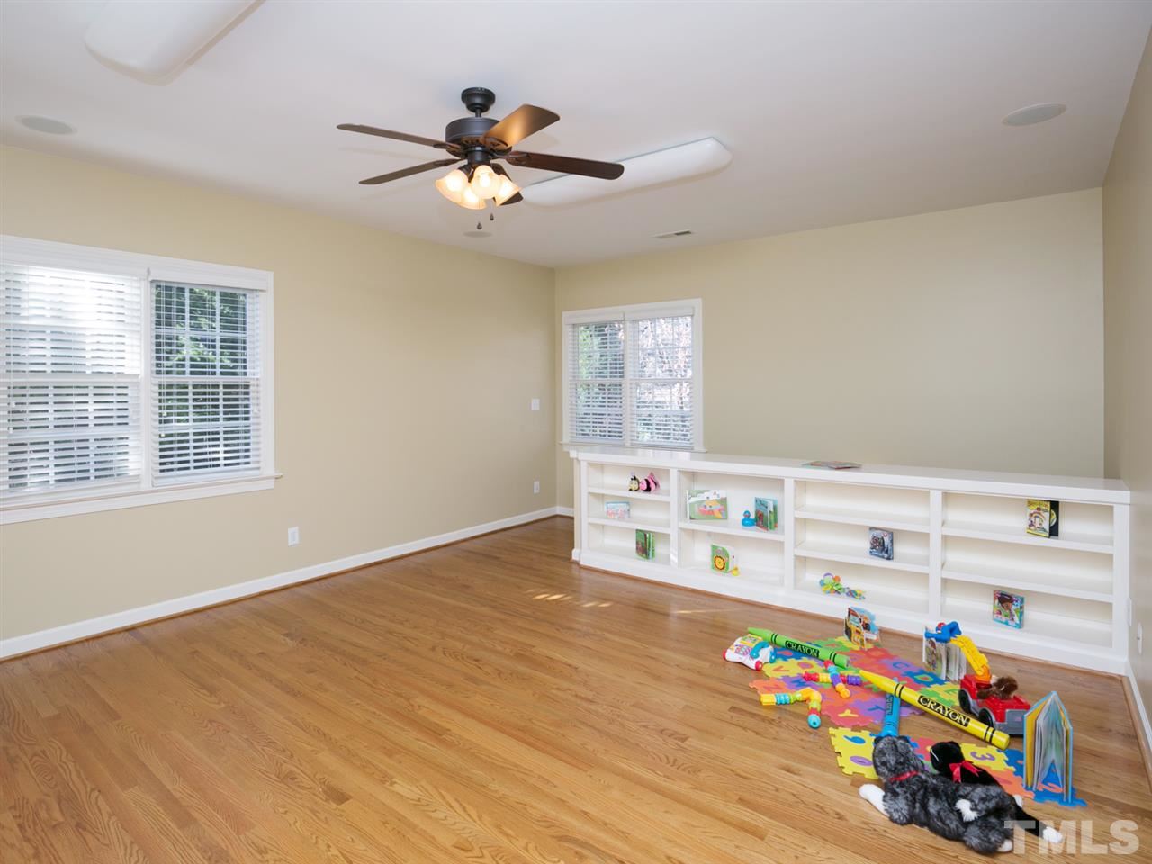 7909 Ridge Pointe Lane Raleigh, NC 27615 - Photo 15 of 25 Bonus room with hardwood; 2 closets; and built in shelving
