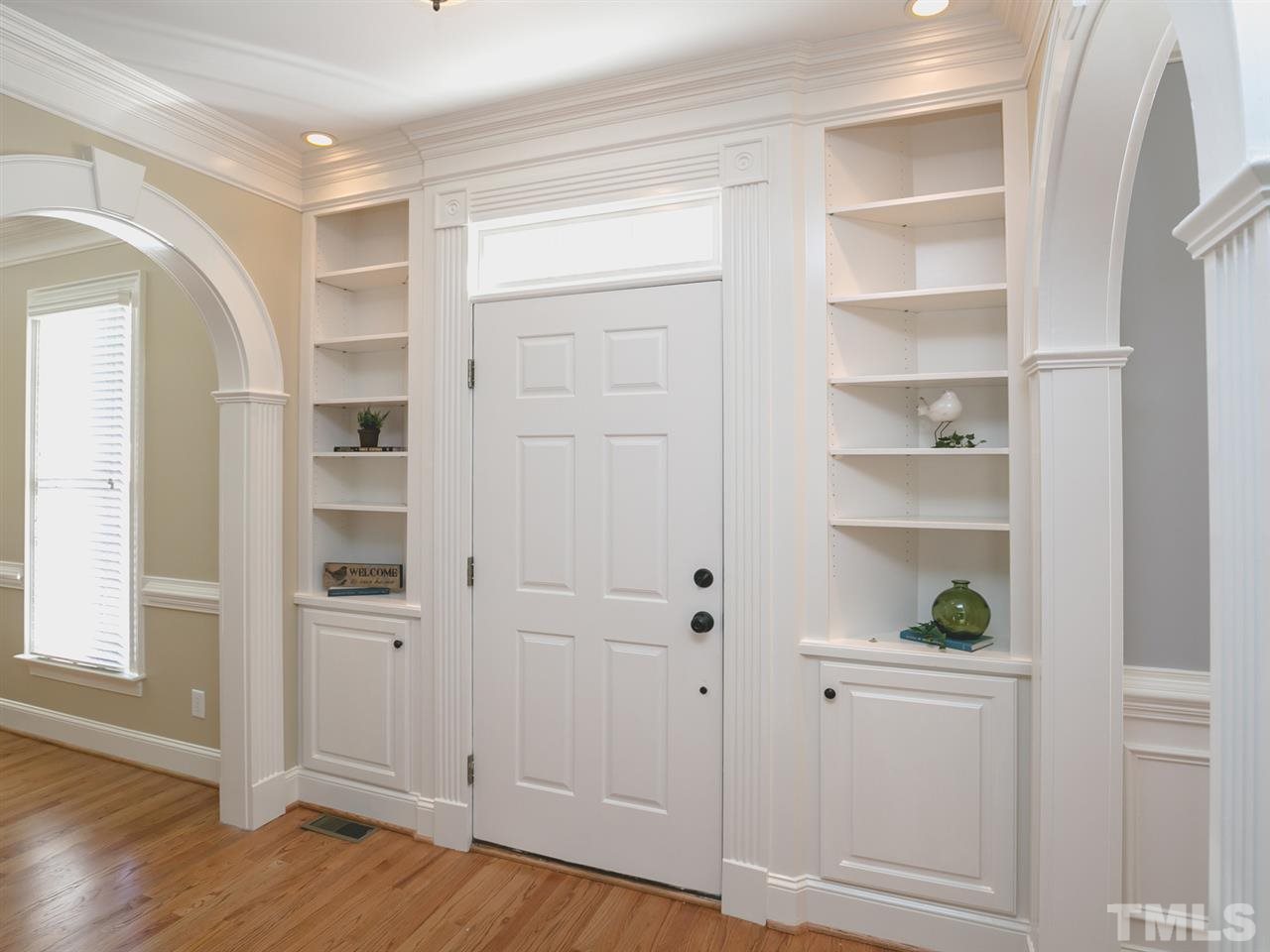 7909 Ridge Pointe Lane Raleigh, NC 27615 - Photo 3 of 25 Built in bookshelves; Refinished hardwoods throughout