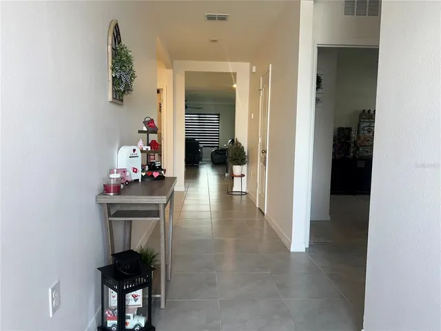 hallway with wooden floor and furniture