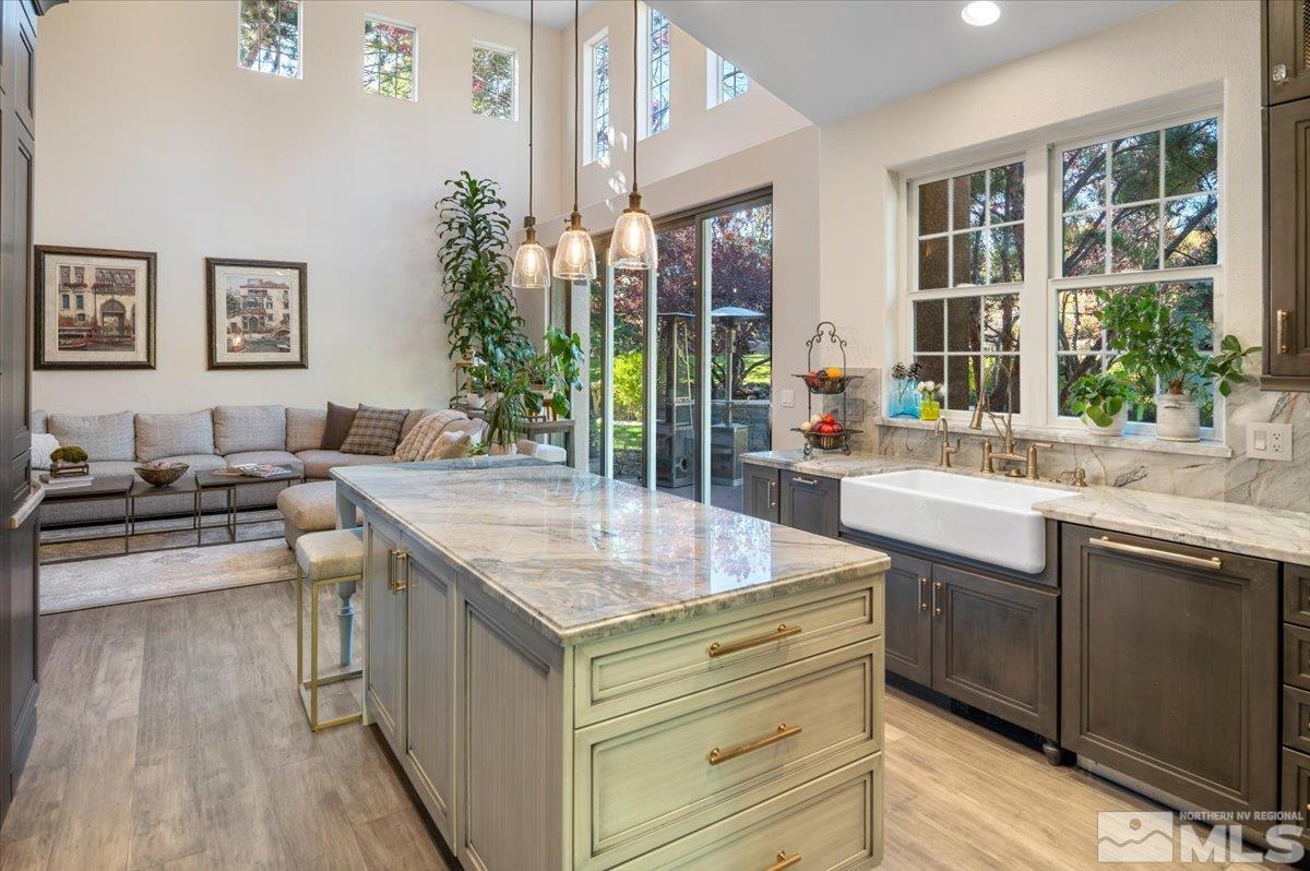 14235 Powder River Court Reno, NV 89511 - Photo 11 of 40 a kitchen with counter top space and painting on the wall