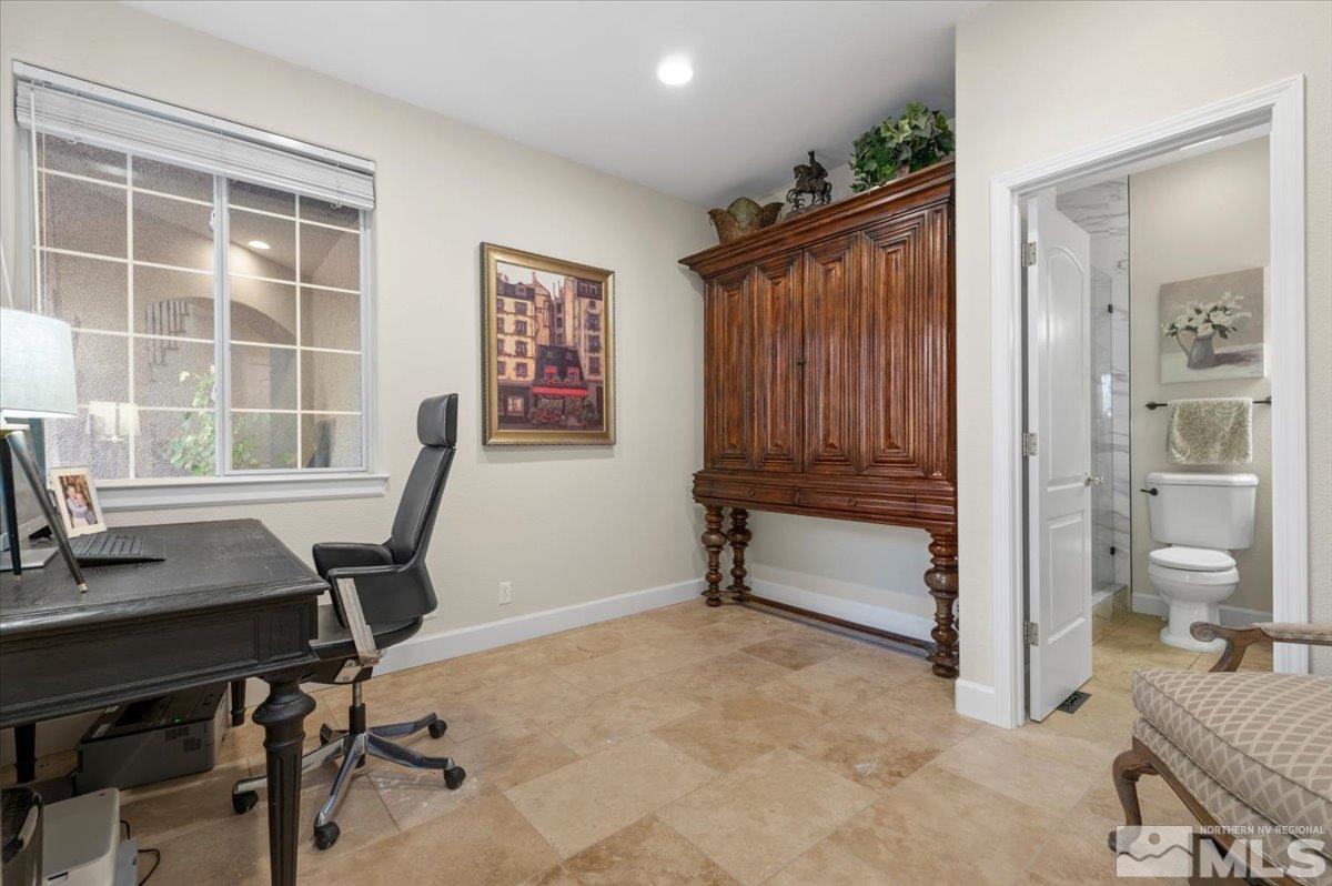 14235 Powder River Court Reno, NV 89511 - Photo 17 of 40 a view of a workspace with furniture and a window